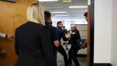 Democrats condemn the senator pushed down and handcuffed at Noem's press conference