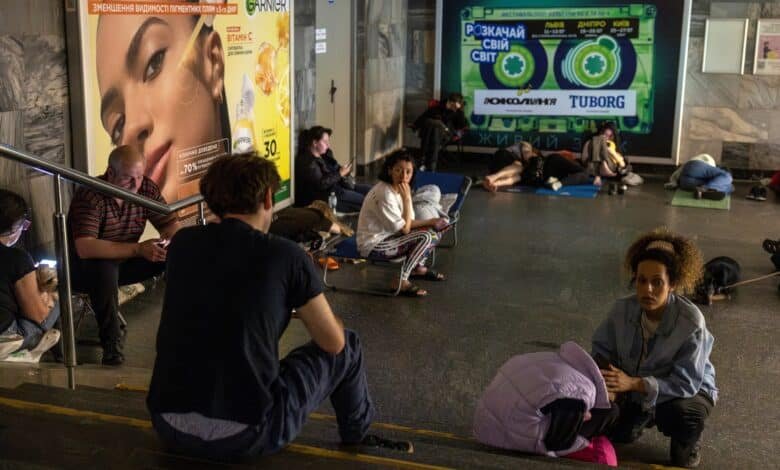 Photo: People take refuge in a subway station during a Russian drone attack in Kyiv