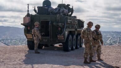 Photo: US Army soldiers are outside a Stryker armored infantry