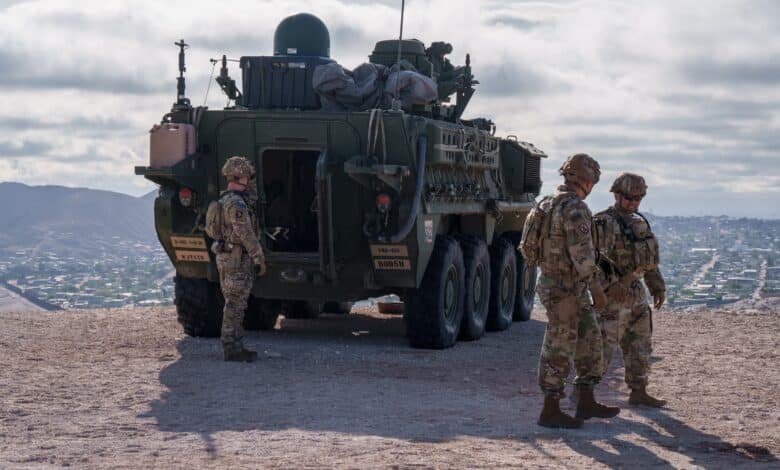 Photo: US Army soldiers are outside a Stryker armored infantry