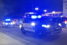 PHOTO: Several police vehicles sound sirens after reports of shots fired at Christmas Tree Lighting in Concord, North Carolina.