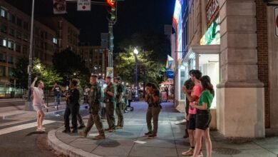 PHOTO: FBI and Border Patrol officers speak with Sean Charles Dunn, August 10, 2025, in Washington, DC