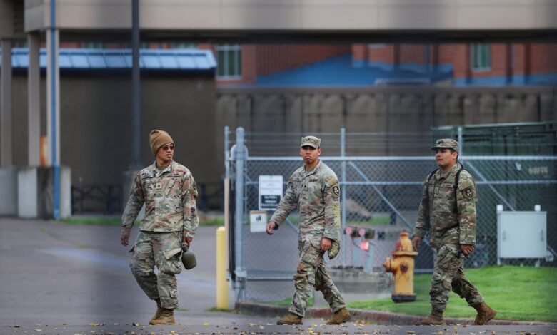PHOTO: Members of the 49th California Military Police Brigade walk the grounds at the Oregon Army National Guard's Camp Withycombe in Happy Valley, Oregon, Oct. 22, 2025.