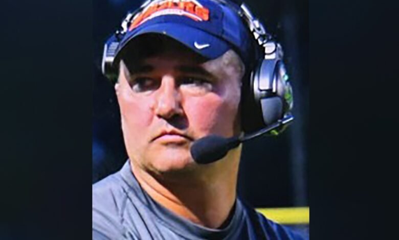 Missing Virginia football coach wanted on child sex abuse charges walked into woods with gun, family says