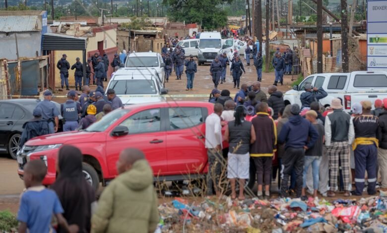 A manhunt begins in South Africa after a group of robbers shot dead nine people in a tavern