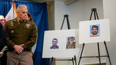 PHOTO: Brigadier General Leland D. Blanchard II looks at photos of two National Guard members who were shot along with a photo of a suspect, Afghan national Rahmanullah Lakanwal, at a news conference in Washington, DC, Nov. 27, 2025.